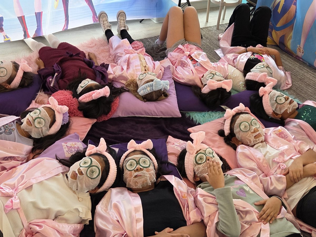 Group of girls relaxing with cucumber spa masks at a Divas Glam Spa Party