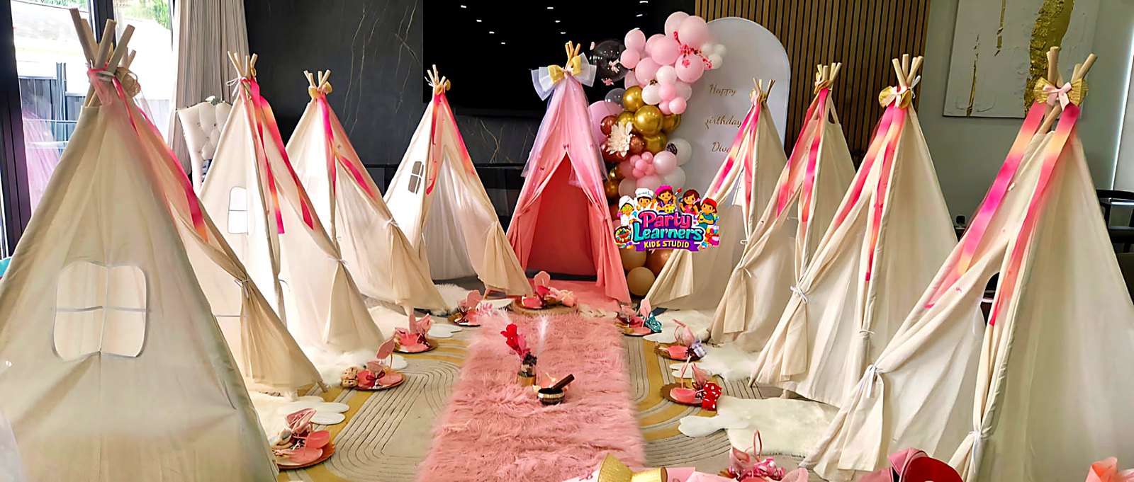 Slumber Party Teepee Setup with multiple teepees, cozy bedding and themed backdrop